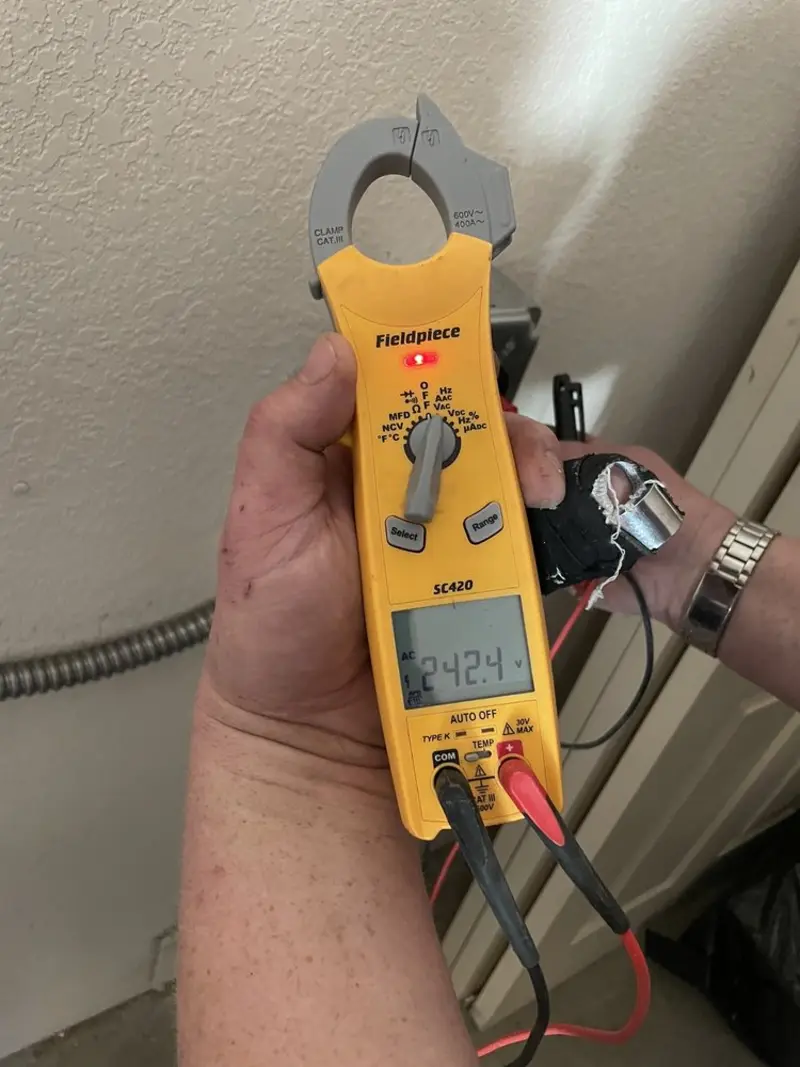 Voltage testing with clamp meter during Recessed Lighting Installation in Litchfield
